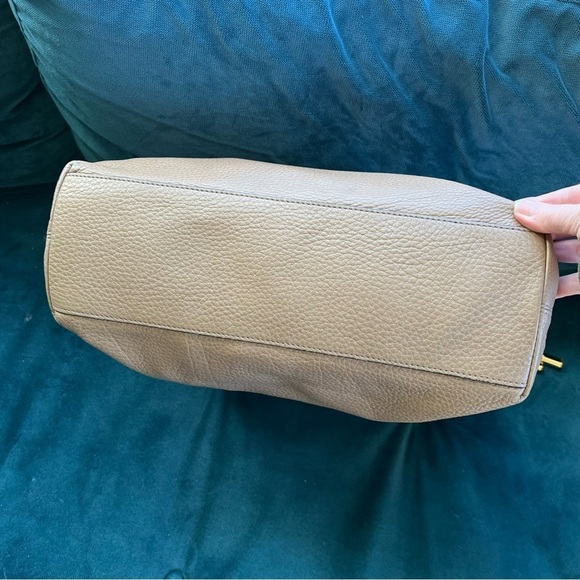 MICHAEL KORS COLLECTION
Skorpios Desert Tan Pebbled Leather Hobo
Bag $79… - Picture 9 of 16